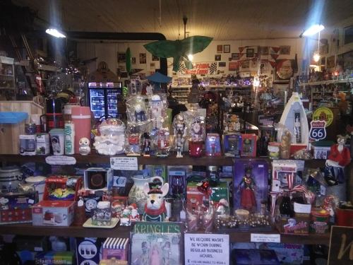 A vibrant display of various collectibles and decorations in a cozy shop, featuring holiday-themed items and souvenirs.