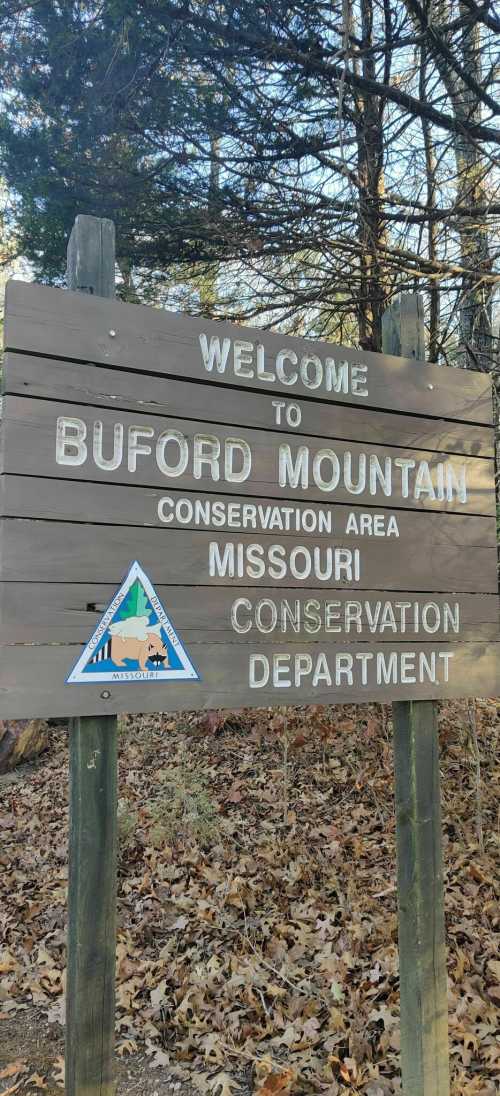 Sign welcoming visitors to Buford Mountain Conservation Area in Missouri, featuring the conservation department logo.