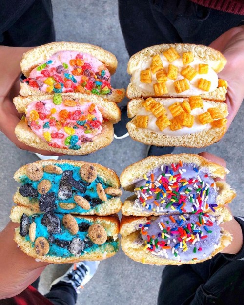 Four colorful ice cream sandwiches held by hands, featuring various toppings like cereal, sprinkles, and candy.