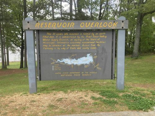 Sign at a reservoir overlook, detailing the area's features and managed by the U.S. National Park Service.
