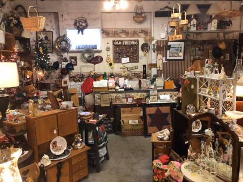 A cozy antique shop filled with various vintage items, furniture, and decor, creating a nostalgic atmosphere.