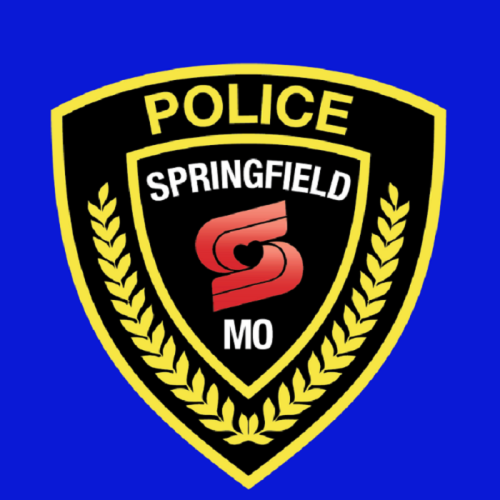 Springfield, MO police badge featuring a black shield with gold trim and a stylized "S" logo.