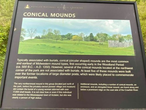 Sign about conical mounds, detailing their historical significance and association with burials in the Midwest.