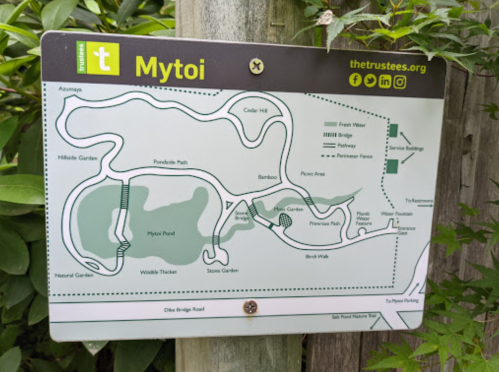 Map of Mytoi with trails, gardens, and facilities marked, surrounded by greenery.