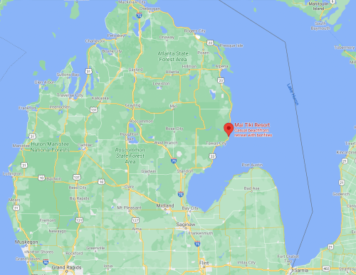 Map showing the location of Mall Tiki Resort in Michigan, near Lake Huron and surrounding forested areas.