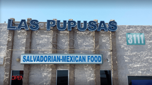 Sign for "Las Pupusas" restaurant featuring "Salvadorian-Mexican Food" with an open neon sign.