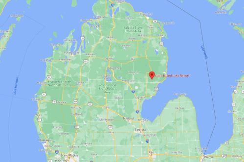 Map showing Michigan with a marker for Little Island Lake Resort, surrounded by lakes and forests.