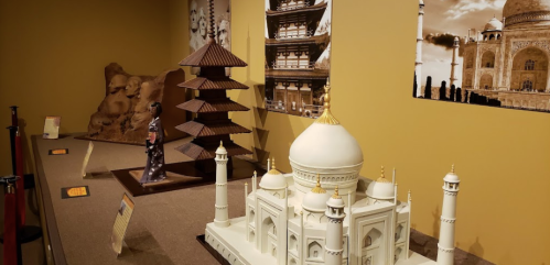 A display featuring miniature models of famous landmarks, including the Taj Mahal and traditional Asian architecture.