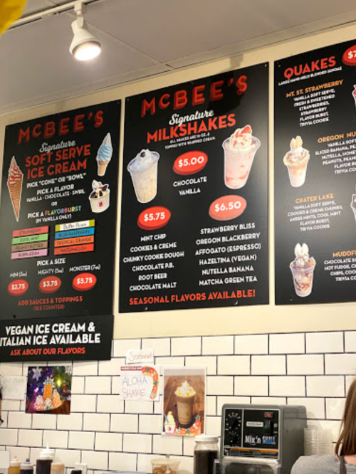 Menu board at McBee's featuring soft serve ice cream, milkshakes, and seasonal flavors with prices listed.