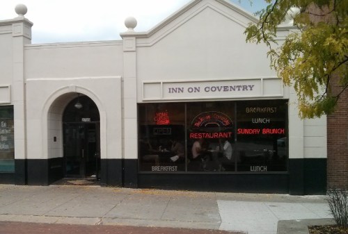 Exterior of Inn on Coventry restaurant, featuring signs for breakfast, lunch, and Sunday brunch.
