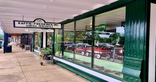 A storefront of Kaffie-Frederick, Inc. General Mercantile, featuring large windows and a classic sign.