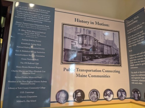 A display panel titled "History in Motion" showcasing Maine's public transportation and community connections with a historic train image.