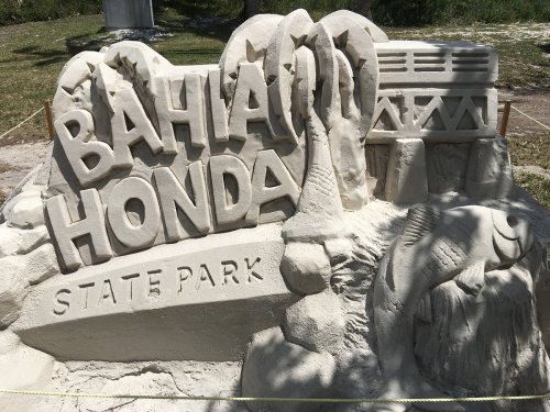 Sand sculpture featuring the words "Bahia Honda State Park" with decorative elements.