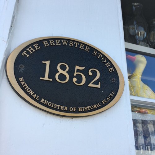 Plaque for The Brewster Store, established in 1852, listed on the National Register of Historic Places.