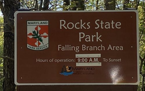 Sign for Rocks State Park, Falling Branch Area, with hours of operation: 9:00 A.M. to Sunset. Maryland Park Service.