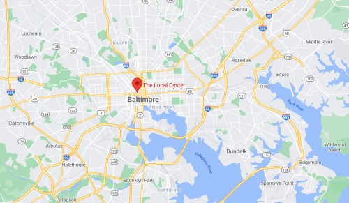 Map showing Baltimore with a marker for "The Local Oyster" restaurant location.
