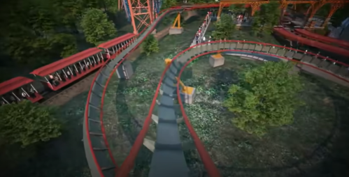 Aerial view of a roller coaster track winding through a green landscape with trees and a train of riders.