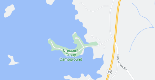 Map showing Crescent Group Campground located near a lake, with surrounding roads and water features.