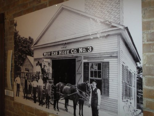 Historic black-and-white photo of West End Hose Co. No. 3, featuring firefighters and a horse-drawn fire wagon.
