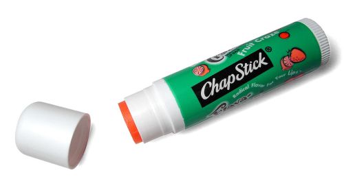 A green ChapStick tube labeled "Fruit Craze" with a white cap, showing the orange lip balm inside.