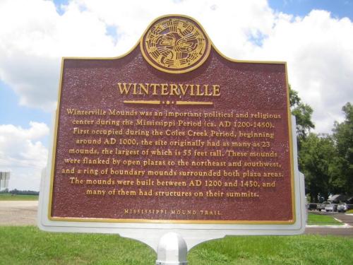 Sign describing Winterville Mounds, a significant archaeological site from the Mississippi Period, highlighting its history and features.