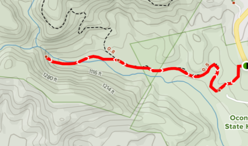 Map showing a red trail winding through Oconee State Park, with elevation markers and surrounding topography.