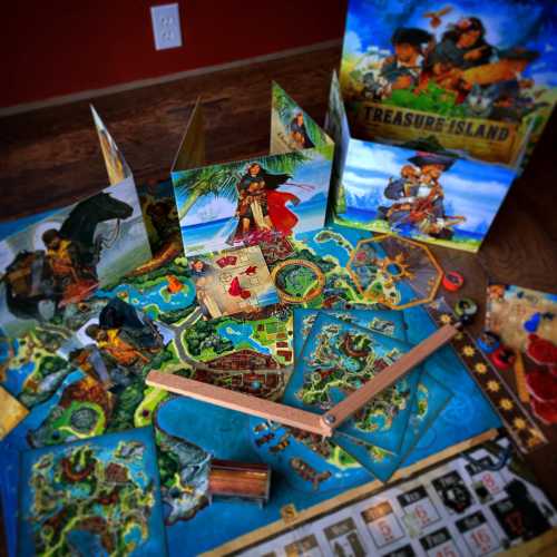 A colorful board game setup featuring maps, cards, and a treasure chest, themed around a pirate adventure.