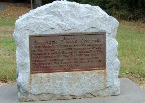 A stone marker commemorating Elizabeth Female College, the first women's college in America, established in 1851.