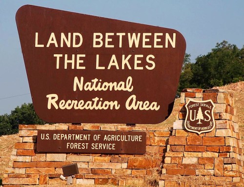 Sign for Land Between the Lakes National Recreation Area, featuring U.S. Department of Agriculture Forest Service logo.