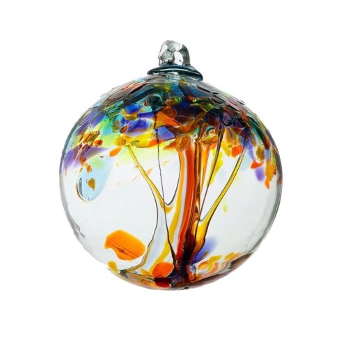 A colorful glass orb featuring a tree design with vibrant hues of orange, blue, and green.