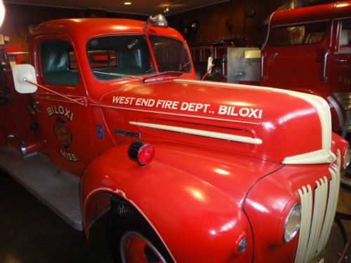 Vintage red fire truck from the Biloxi West End Fire Department, showcasing classic design and historical significance.