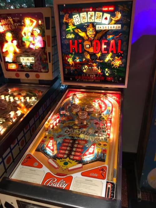A colorful vintage pinball machine titled "Hi Deal" with vibrant artwork and illuminated playfield features.