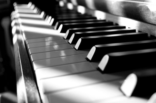 Close-up of piano keys in black and white, showcasing the contrast between the black and white keys.
