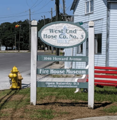 Sign for West End Hose Co. No. 3 Fire House Museum in Biloxi, featuring visiting hours and location details.