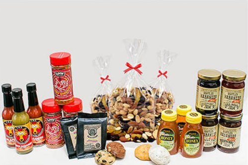 An assortment of sauces, nuts, honey, and cookies arranged neatly on a white background.
