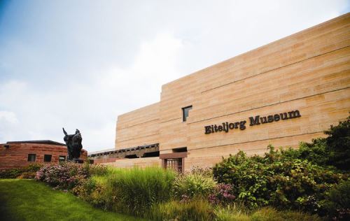 Exterior view of the Eiteljorg Museum, featuring modern architecture and landscaped gardens.