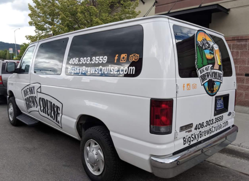 White van with "Big Sky Brews Cruise" branding, featuring contact info and social media icons on the side.