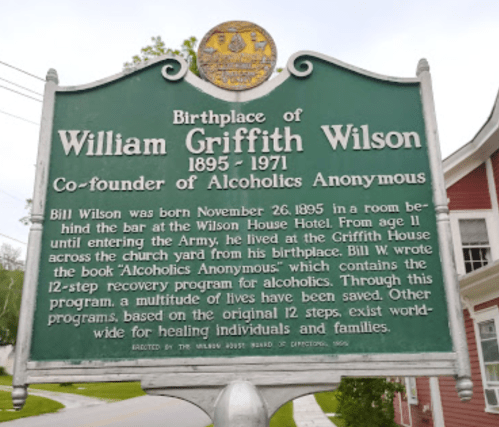 Historical marker for William Griffith Wilson, co-founder of Alcoholics Anonymous, detailing his birthplace and contributions.