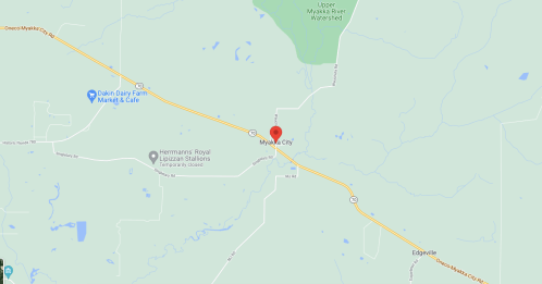 Map showing Myoka City, located along a highway with surrounding green areas and roads.