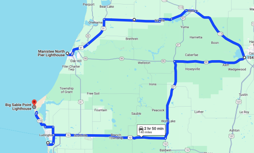 Map showing a route from Big Sable Point Lighthouse to Manistee North Pier Lighthouse, covering 154 miles in 2 hours 50 minutes.