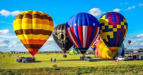 Vibrant hot air balloons ready to launch at Sunflower Balloon Fest in Anthony, Kansas
