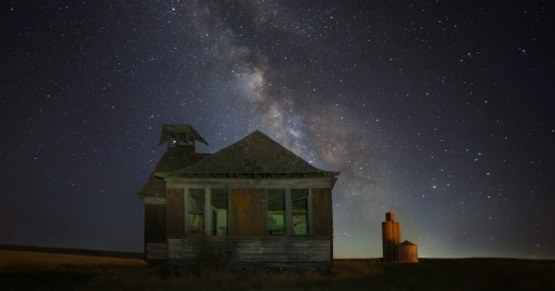 An abandoned building in Govan, Washington at night with the Milky Way.