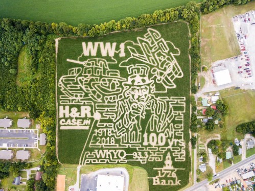 Aerial view of a corn maze featuring WWI themes, including planes and a soldier, celebrating 100 years since 1918.