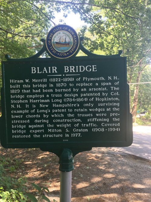 Sign detailing the history of Blair Bridge in New Hampshire, highlighting its design and construction by Hiram W. Merrill.