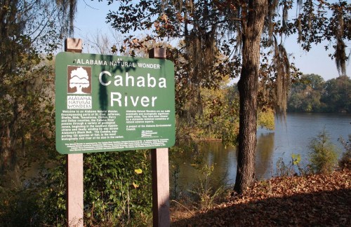 Sign for Cahaba River, labeled as an Alabama Natural Wonder, with a scenic river and trees in the background.