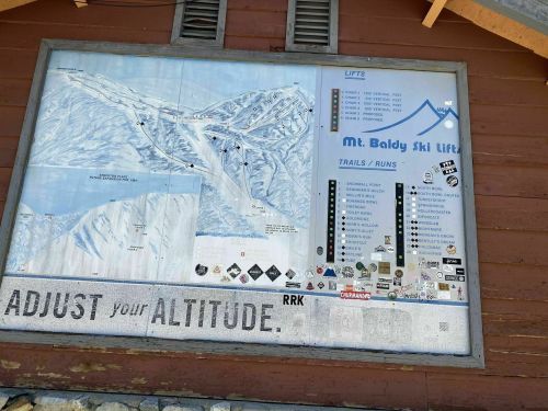 Map of Mt. Baldy Ski Resort showing lifts, trails, and runs with a sign that reads "Adjust your Altitude."