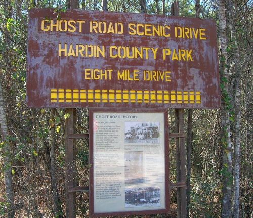 Sign for Ghost Road Scenic Drive in Hardin County Park, featuring historical information and scenic drive details.