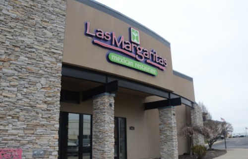 Exterior of Las Margaritas Mexican Restaurant, featuring a stone facade and colorful signage.
