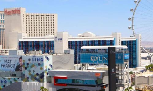 View of the LINQ Hotel and Casino in Las Vegas, with the High Roller Ferris wheel in the background.