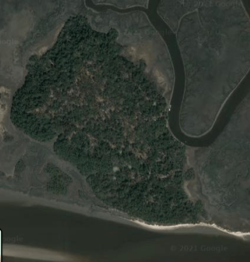 Aerial view of a lush, green island surrounded by winding waterways and sandy shores.